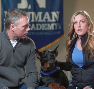 Clients with their Doberman during a video testimonial